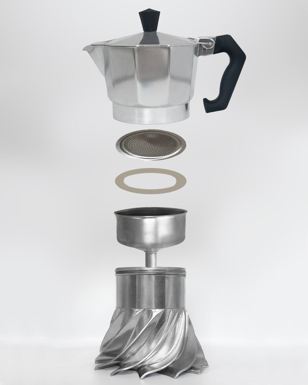 Exploded view of the Turbo Moka 3-cup showing every part in the spare parts kit: top chamber, filter plate, silicone gasket, funnel and boiler